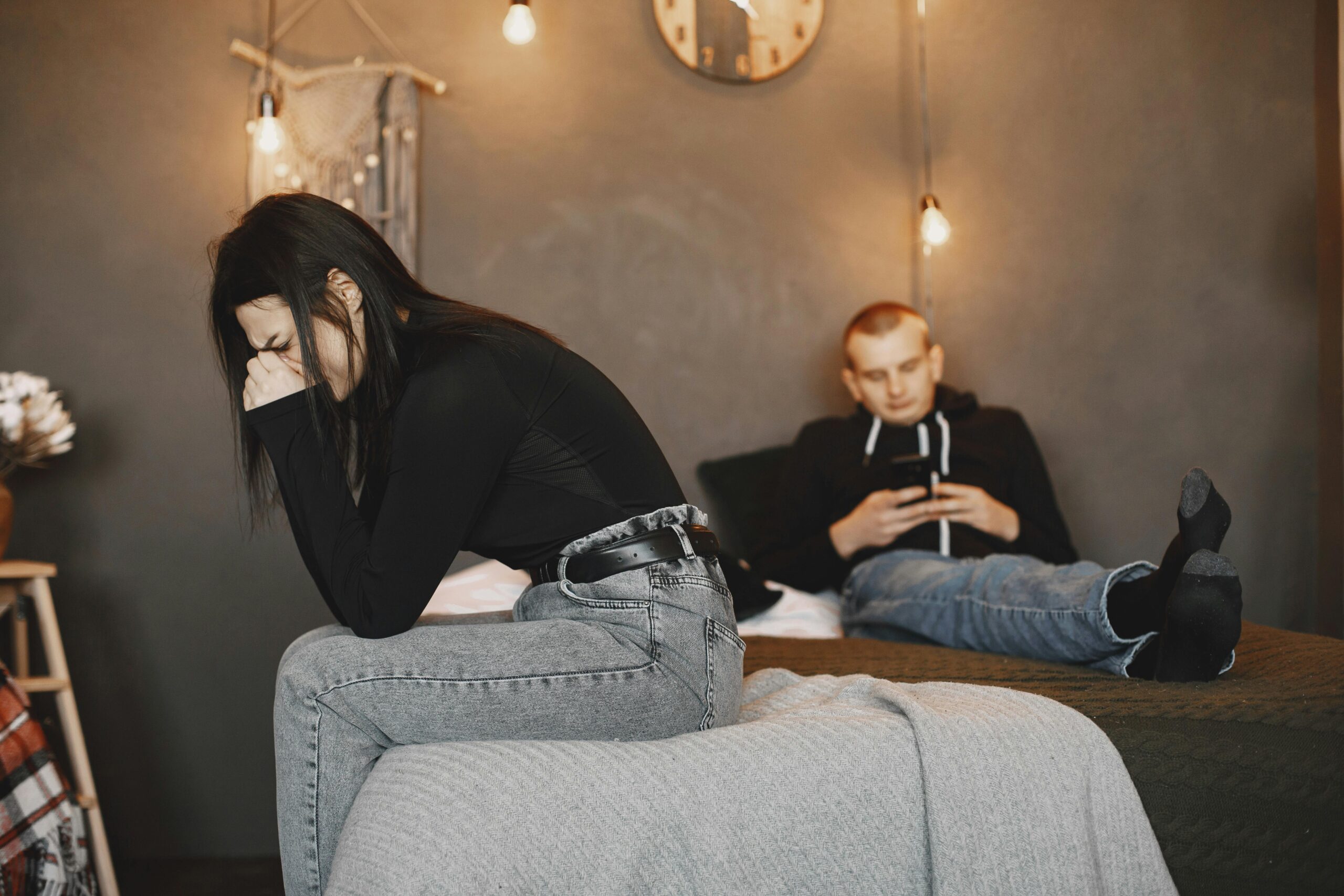 A couple experiencing tension and distance, highlighting relationship challenges.