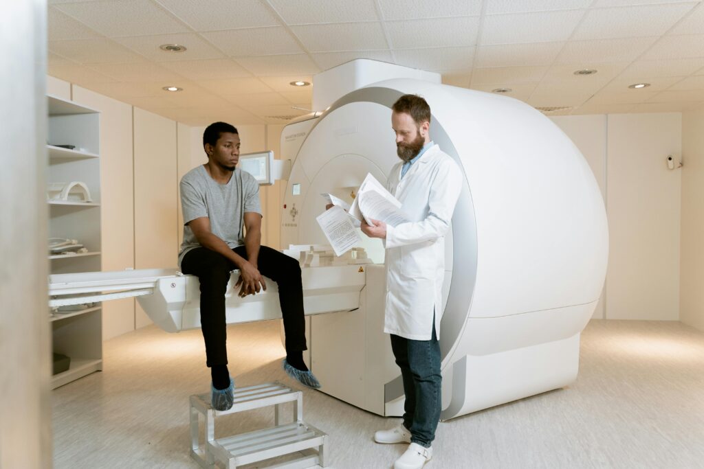 A doctor discusses MRI scan results with a patient in a modern hospital setting.